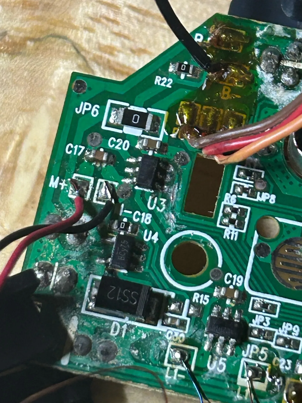 Cutting the trace between U3 and the factory chip under the black epoxy