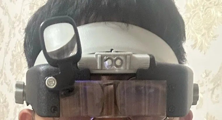 Soldering with a head-mounted magnifier